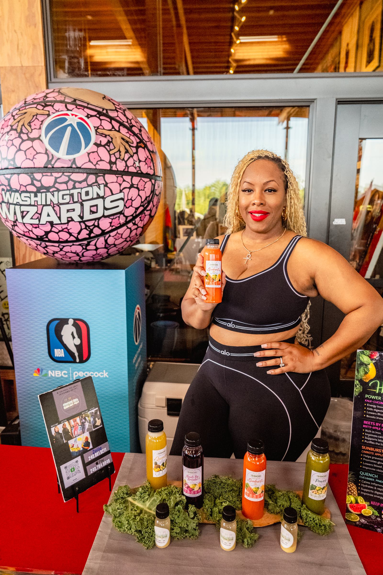 Vendor at the juice table with the Washington Wizards branding