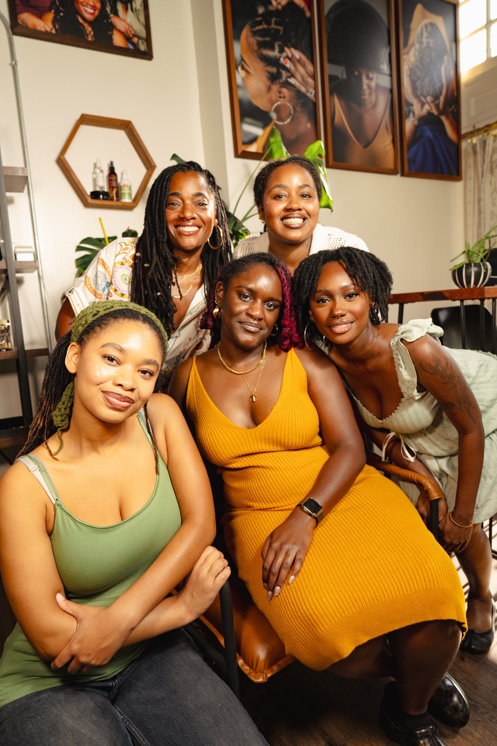 The salon owner with four women from her team, all smiling